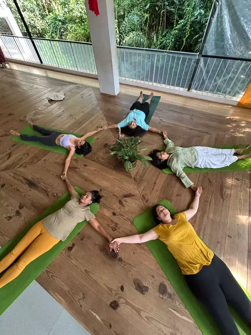 Women in savasana circle